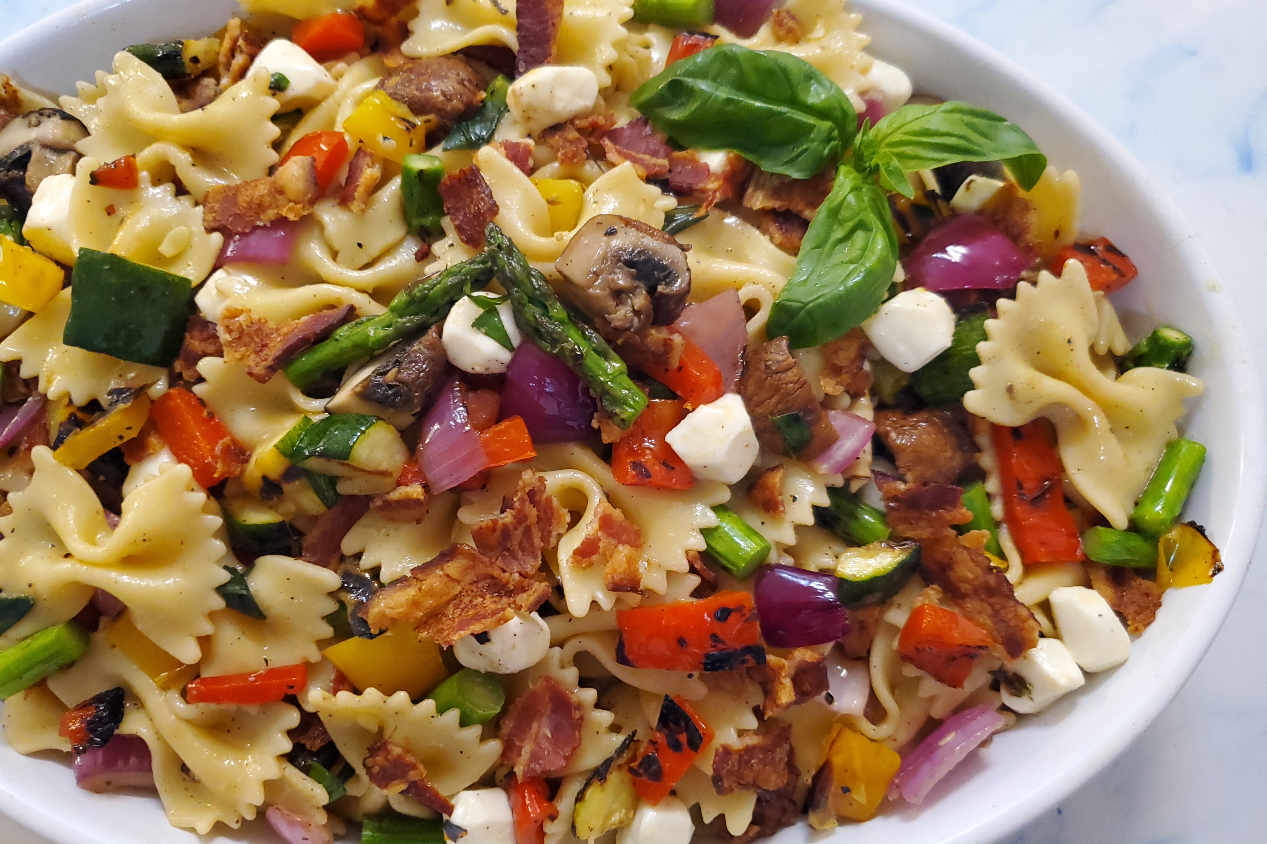 Pasta salad with bacon highlight the robust flavor of grilled vegetables - Vimarsana News
