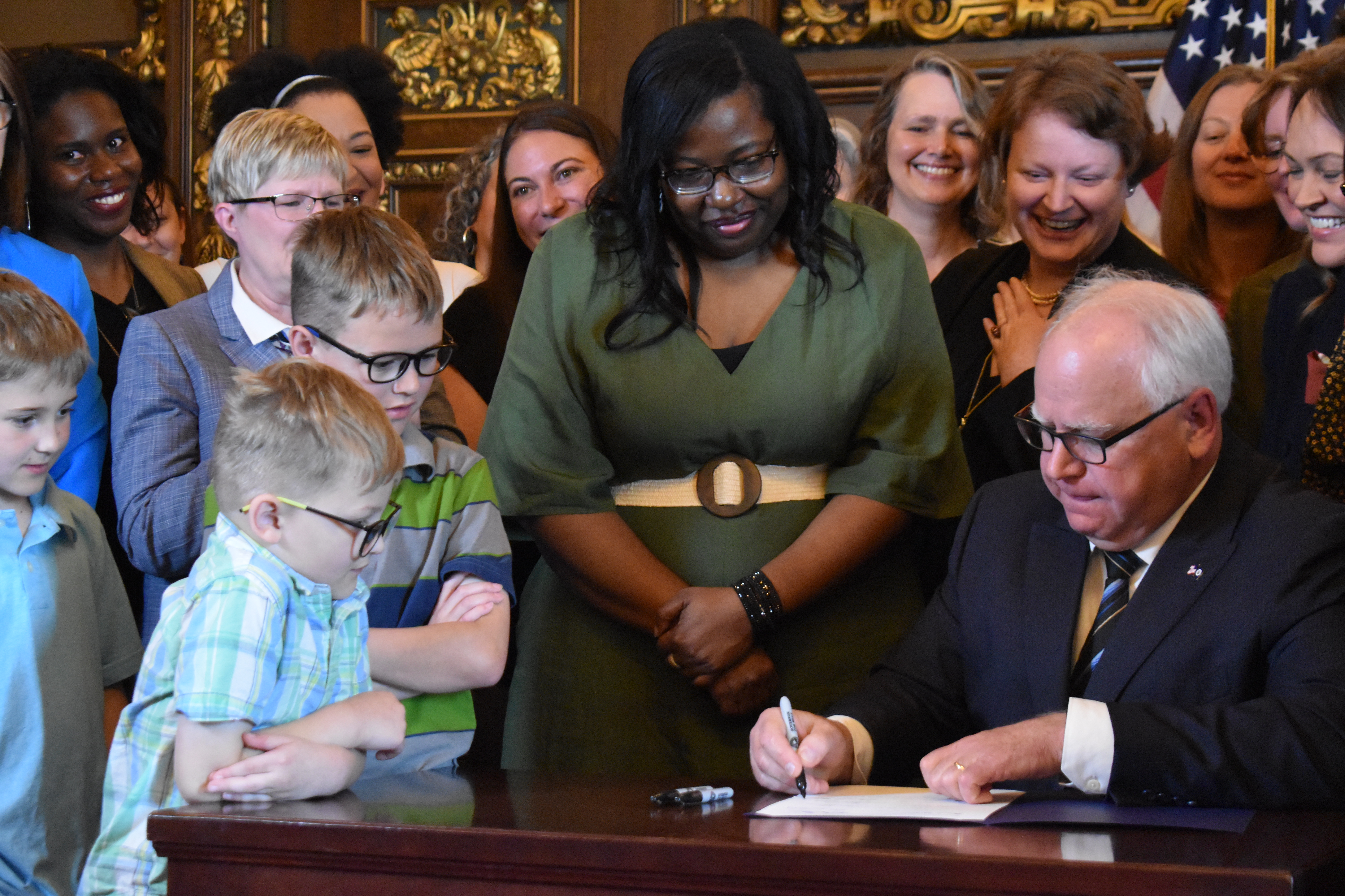 Walz enacts Minnesota paid family and medical leave plan - Vimarsana News